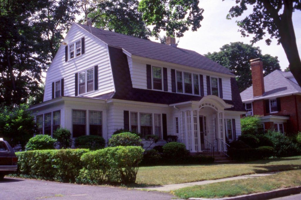 Representative Dutch Colonial, which was popular in the 1920’s through the 40’s, part of the Colonial Revival movement in architecture.