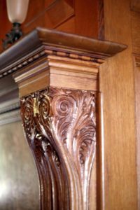 A mantel detail from a Colonial Revival style interior. 