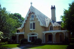 Built in 1846 in New Bedford, MA, this asymmetrical Gothic cottage has siding that is flush-boarded and colored to look like sandstone