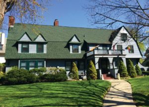 This architect-designed house is a textbook example of the Shingle style.