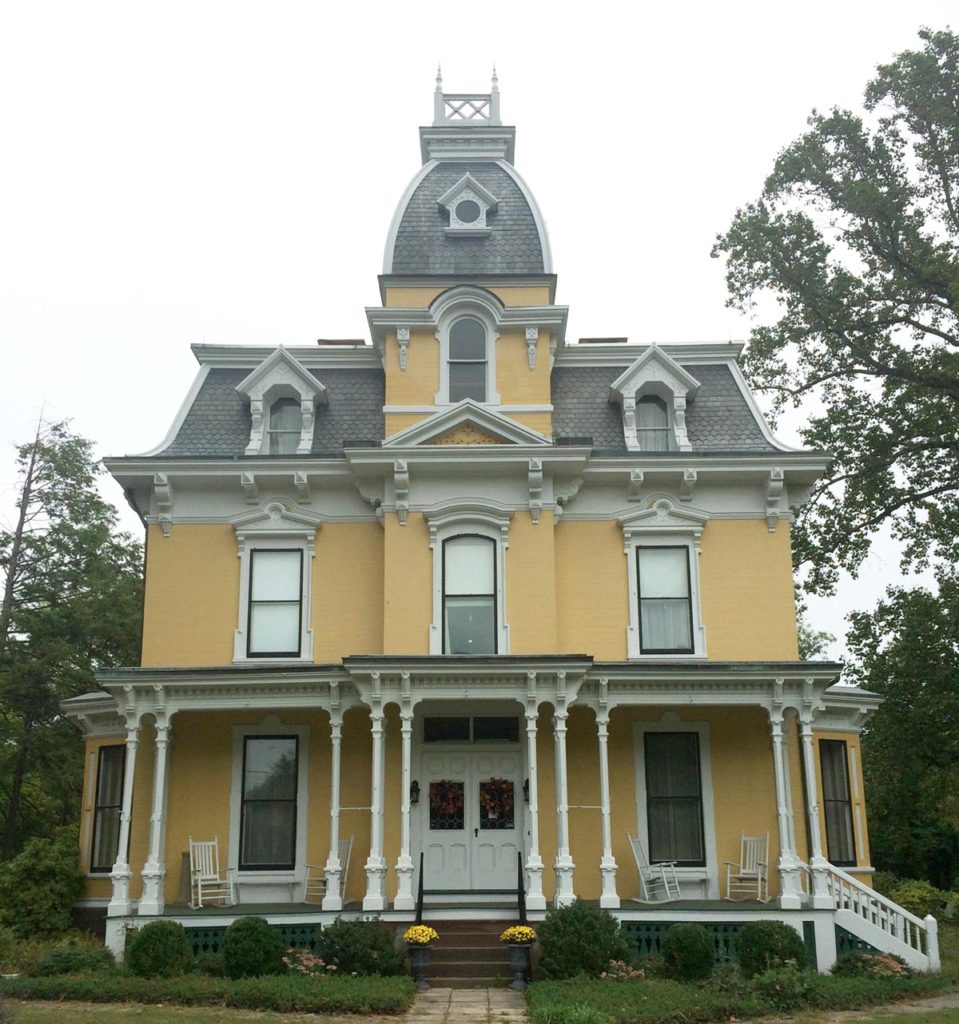 Second Empire home with a convex roof tower.