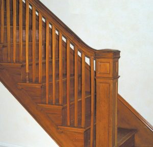 Interior detail of a Gumwood balustrade and newel post in an American Foursquare house.