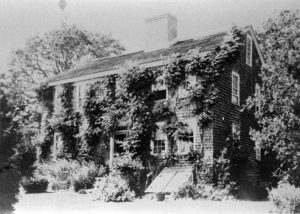 The Carr Homestead blanketed with climbing vines.