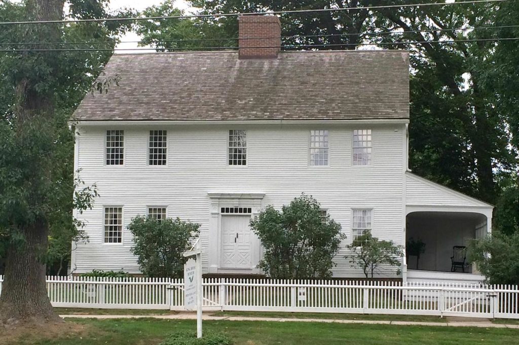 Great textbook Georgian version includes slightly under-sized windows and cross bucked doors framed with a solid, heavily molded Georgian surround.