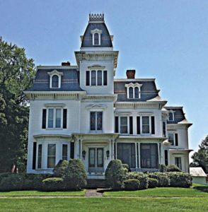 House with convex Mansard Tower with concave Mansard Roof.