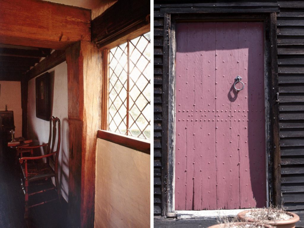 Early antique home with diamond pane window and hobnail door.