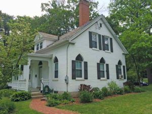 A Gothic Cottage with cute transoms above the windows