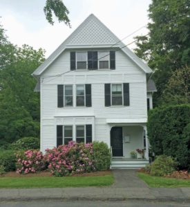 Mix of stick style and Queen Anne style home. 