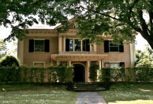 The huge massing of this house makes me wonder is this a Colonial Revival that was preceded by a huge Victorian?