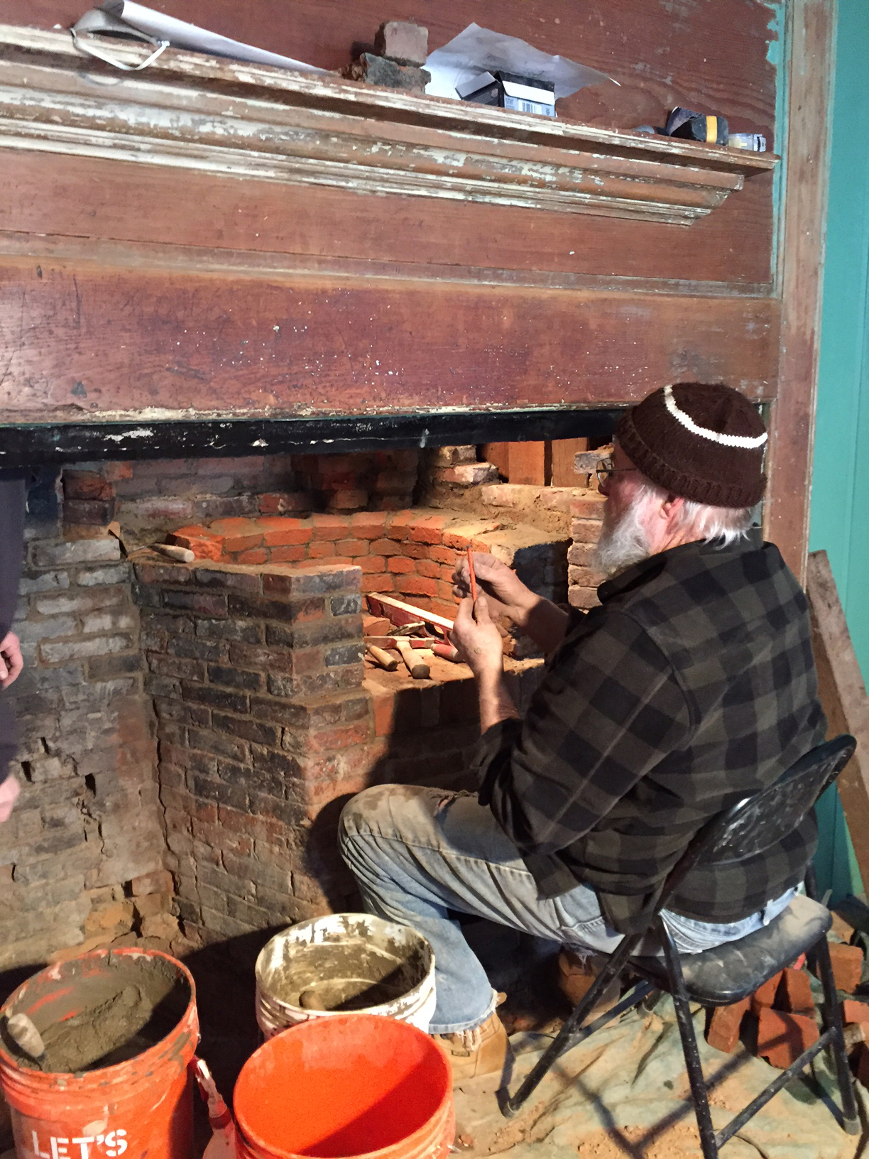 Richard Irons restoring a bee hive oven.