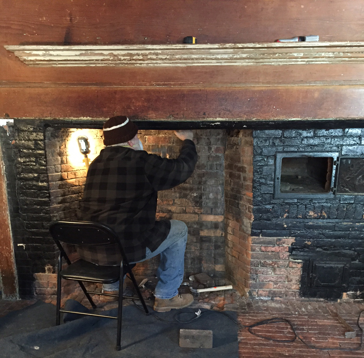 Restoring a keeping room fireplace brick by brick.