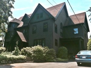 Shingle style with a Tudor influence like homes you might find in Bar Harbor.