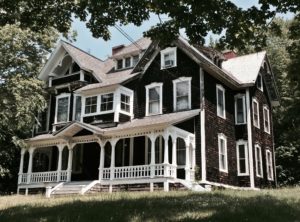 Stick style home, maybe even from the very late 1870s with an 1880s/1890s porch addition.