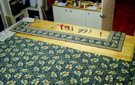 Stitching together the carpet rolls.